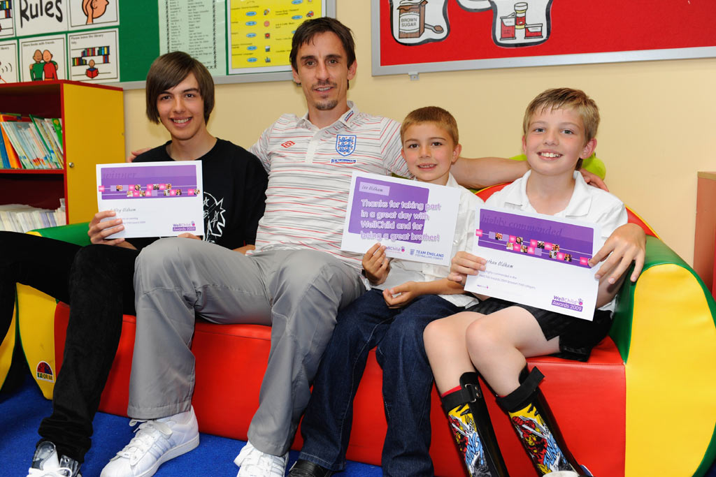 Gary Neville visits Hawthorns Community School in Manchester to present an award on behalf of WellChild.